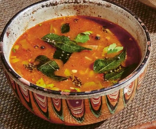 Tomato rasam broth with leek and coriander