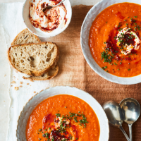 Tomato, red pepper and sweet potato soup with harissa yogurt