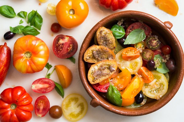 Tomato salad with anchovy toasts