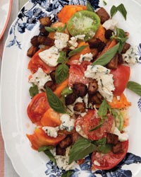Tomato salad with bacon, blue cheese and basil