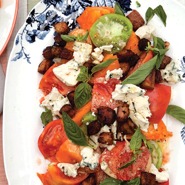Tomato salad with bacon, blue cheese and basil