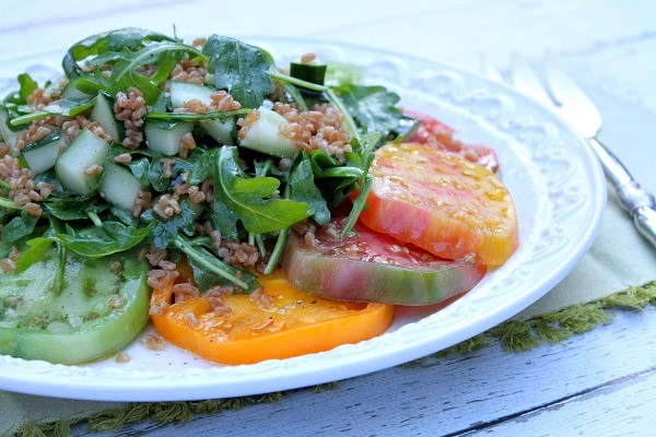 Tomato salad with crisped farro, cucumber and arugula with Italian vinaigrette