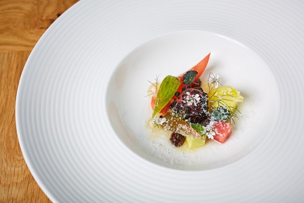  Tomato salad with guacamole, black garlic and essence vinaigrette