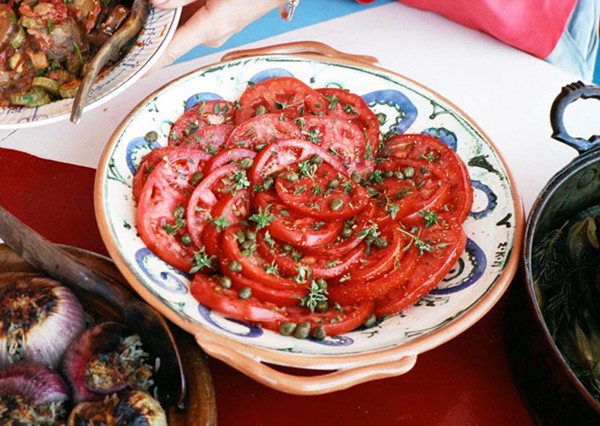 Tomato salad with shallot vinaigrette, capers, and basil