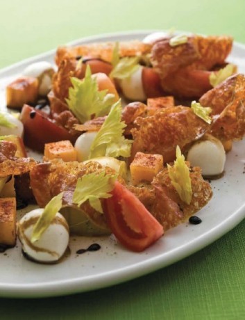 Tomato salad with smoky melon and spicy salami