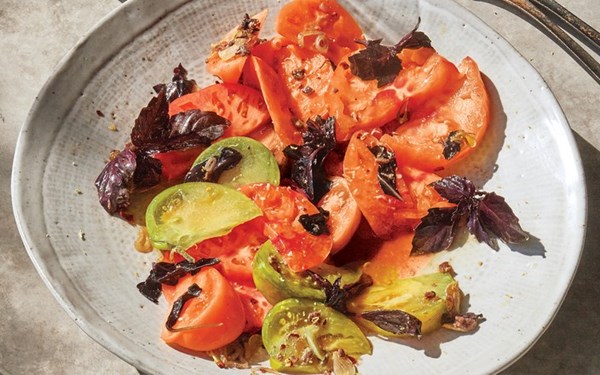 Tomato salad with warm basil dressing