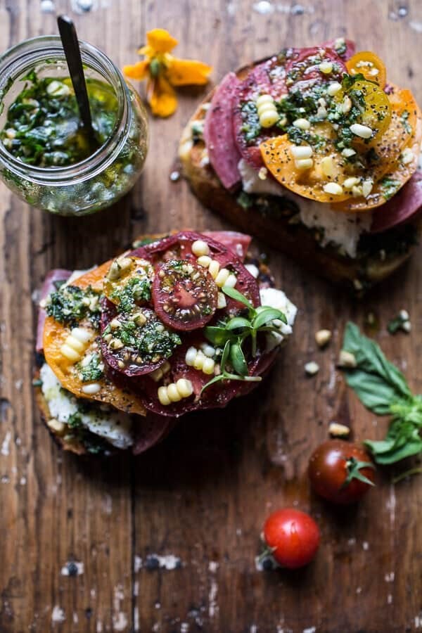 Tomato, salami and chunky arugula-basil pesto bruschetta