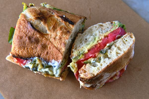 Tomato sandwich with zucchini butter