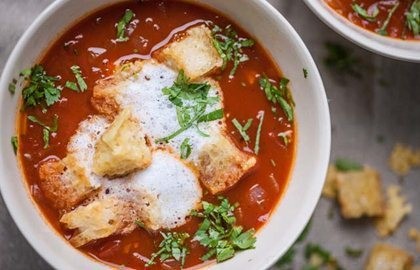 Tomato soup with cheesy croutons and bubbles