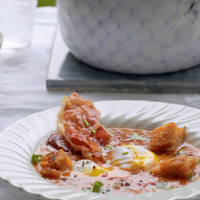 Tomato soup with coriander and poached egg