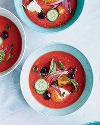 Tomato soup with feta, olives and cucumbers