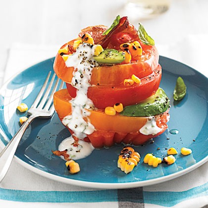 Tomato stack salad with corn and avocado