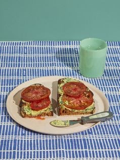 Tomato tartine with green anchovy butter