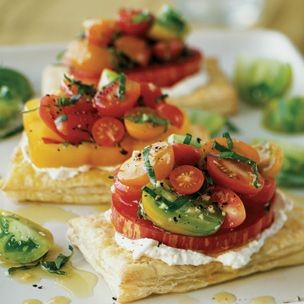 Tomato tarts with basil and fresh goat cheese