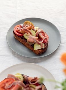 Tomatoes and tapenade on toast