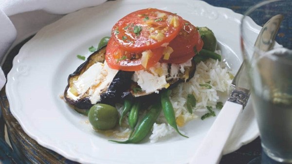 Tomatoes with roasted eggplant, green beans and goat's cheese on basmati rice