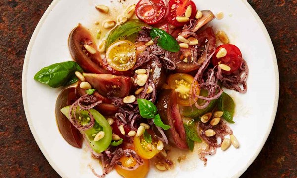 Tomatoes with sumac onions and pine nuts