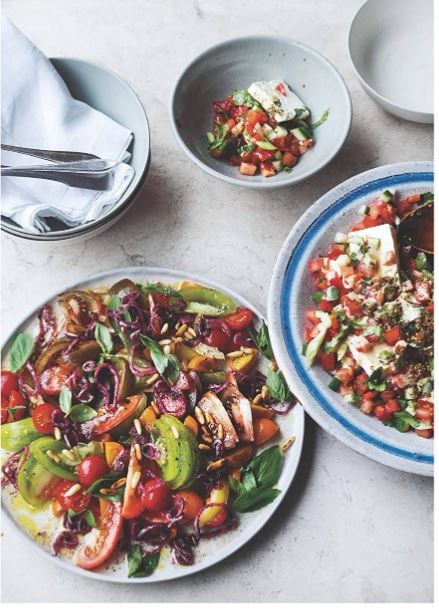 Tomatoes with sumac onions and pine nuts