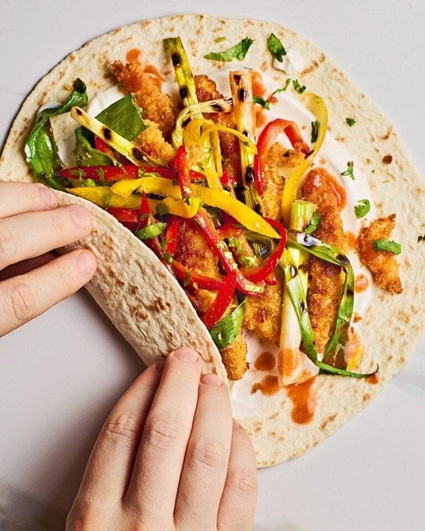 Tom’s crispy chicken fajitas with charred spring onions and Tex-Mex slaw