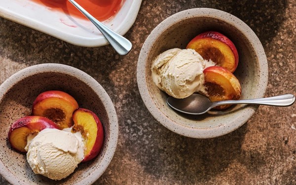 Tonka bean ice cream with baked peaches