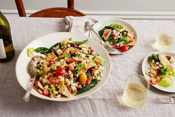 Torn pita panzanella/fattoush with salad greens, sumac & feta cheese