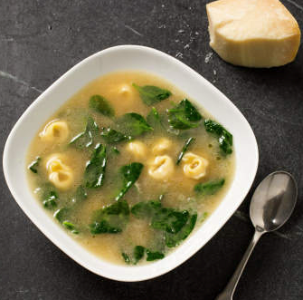 Tortellini in broth with spinach