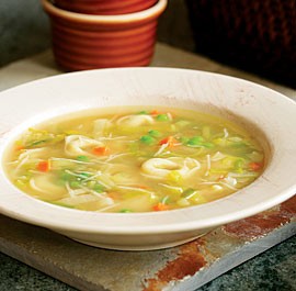 Tortellini soup with carrots, peas, and leeks