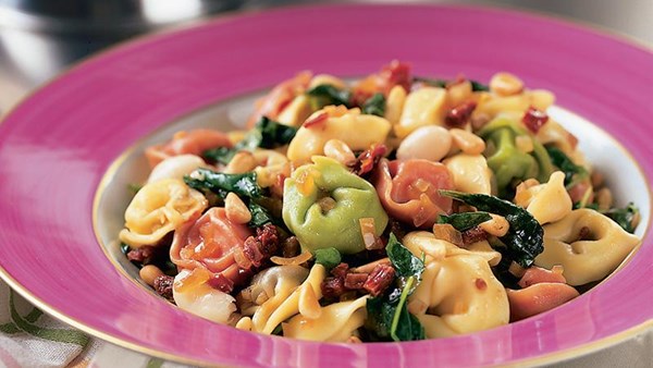 Tortellini with arugula, white beans, and pine nuts