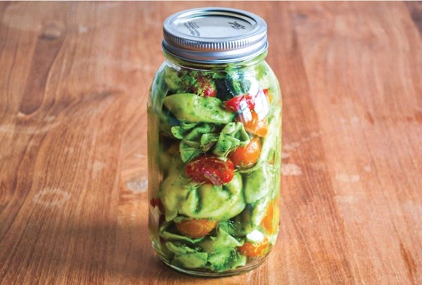 Tortellini with basil pesto, cherry tomatoes and mozzarella