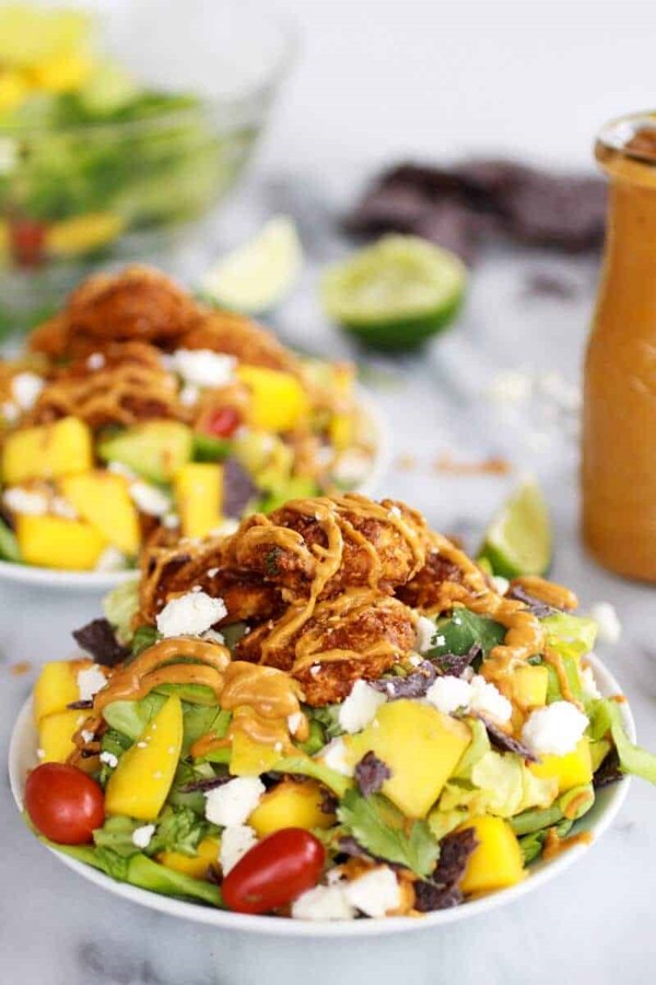 Tortilla chip crusted chicken salad with avocado chipotle lime dressing and queso fresco
