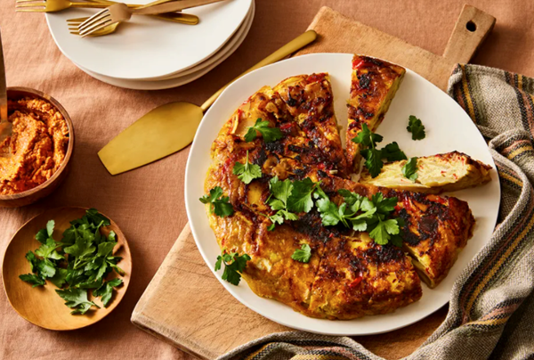 Tortilla Española with blistered cherry tomato romesco