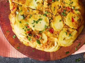 Tortilla Española with potatoes and red sweet peppers 
