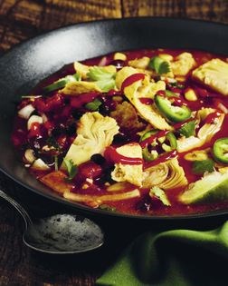Tortilla soup with black beans and artichokes