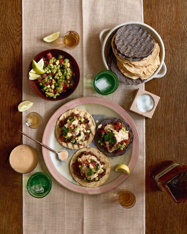 Tostada with Casheta chipotle sauce, refried beans & salsa