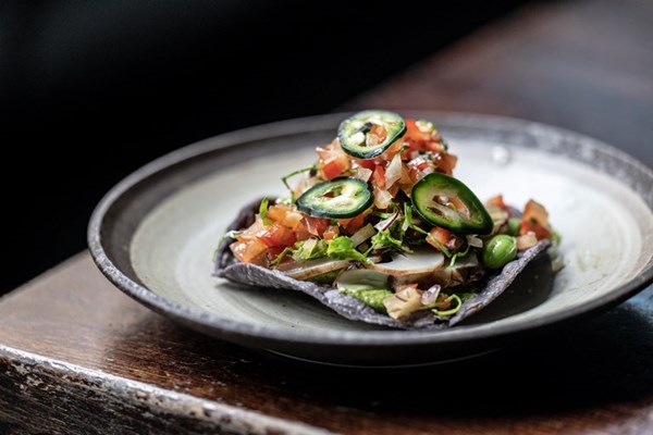 Tostada with Jerusalem artichoke, pico de gallo and broad bean 'guacamole'