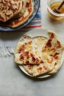 Transylvanian griddle breads with cheese and honey