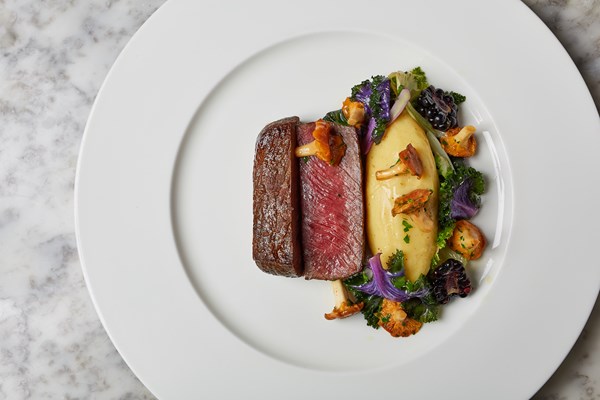Treacle-cured venison with brown butter pommes purée, kale and girolles