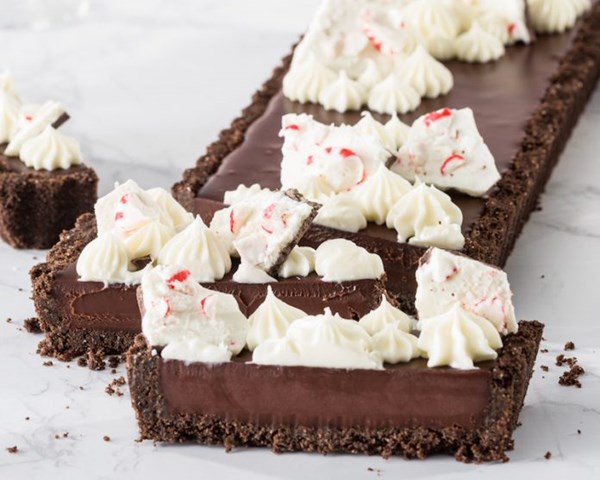 Triple-chocolate peppermint tart [white chocolate frosting, simple salted peppermint bark]