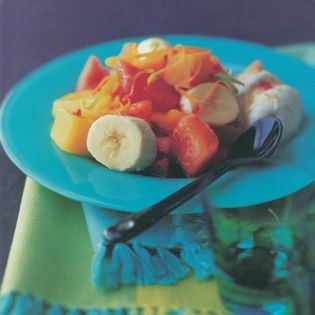 Tropical fruit salad & ice cream with hot citrus syrup