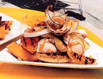Tropical-fruit splits with rum sauce and chile-macadamia brittle