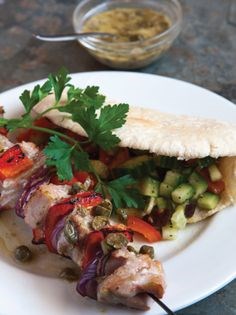 Tuna kebabs with caper sauce