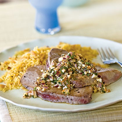 Tuna scaloppine with onion, mint, and almond topping