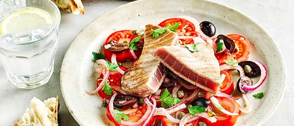 Tuna with marinated tomato and olive salad