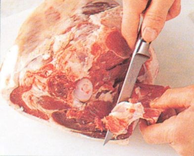 Tunnel boning a leg of lamb