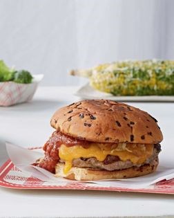 Turkey burgers with caramelized onions, cheddar, and peach chipotle ketchup
