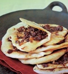 Turkish pizza with red-hot spiced lamb and tomatoes