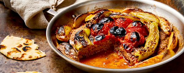 Turkish skillet kebab with charred peppers and tomatoes