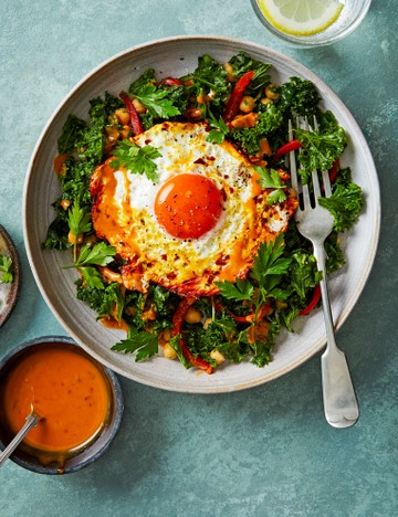 Turmeric fried eggs and kale salad