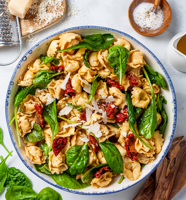 Tuscan tortellini salad with spinach and sun-dried tomatoes
