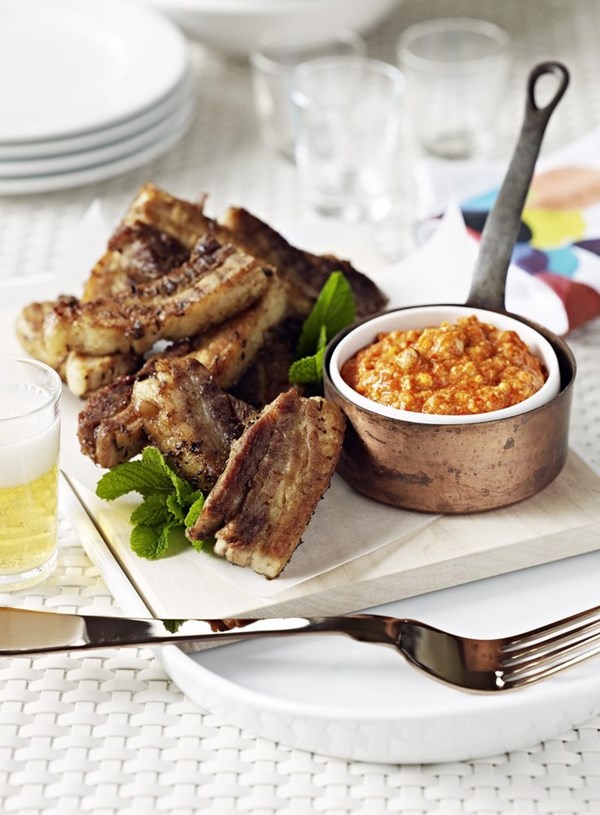 Twice cooked pork belly with roasted capsicum and hazelnut sauce